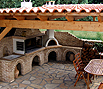 CODE 4: Barbeque compilation, with bench, marble sink and oven, coated with demolition bricks, tiled roof and floor with irregular Albanian stones