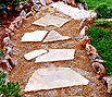 CODE 7: Garden path, with Aris stone on the sides, paved with small pebble and steps from multiangled beige plate